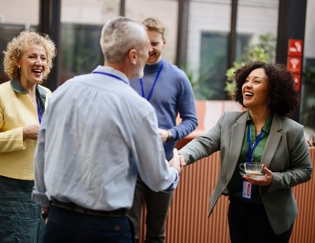 Business people networking during coffee break at conference