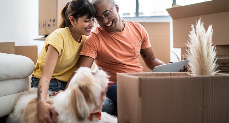 Couple in new home with their dog