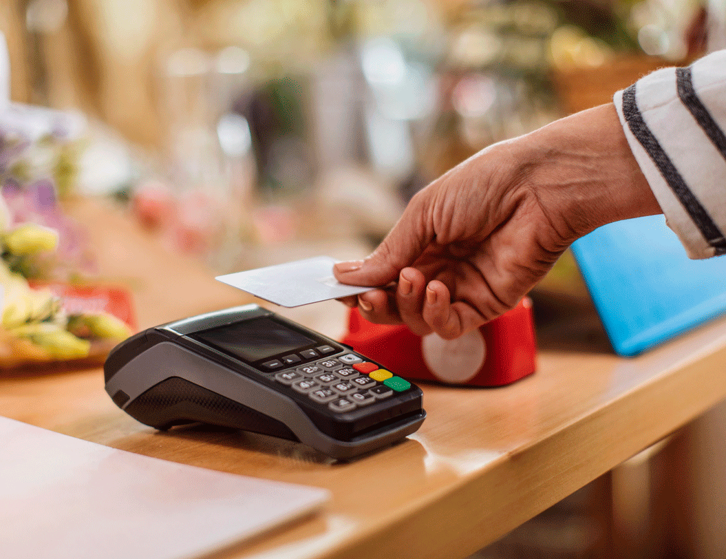 Woman making a purchase with her debit card