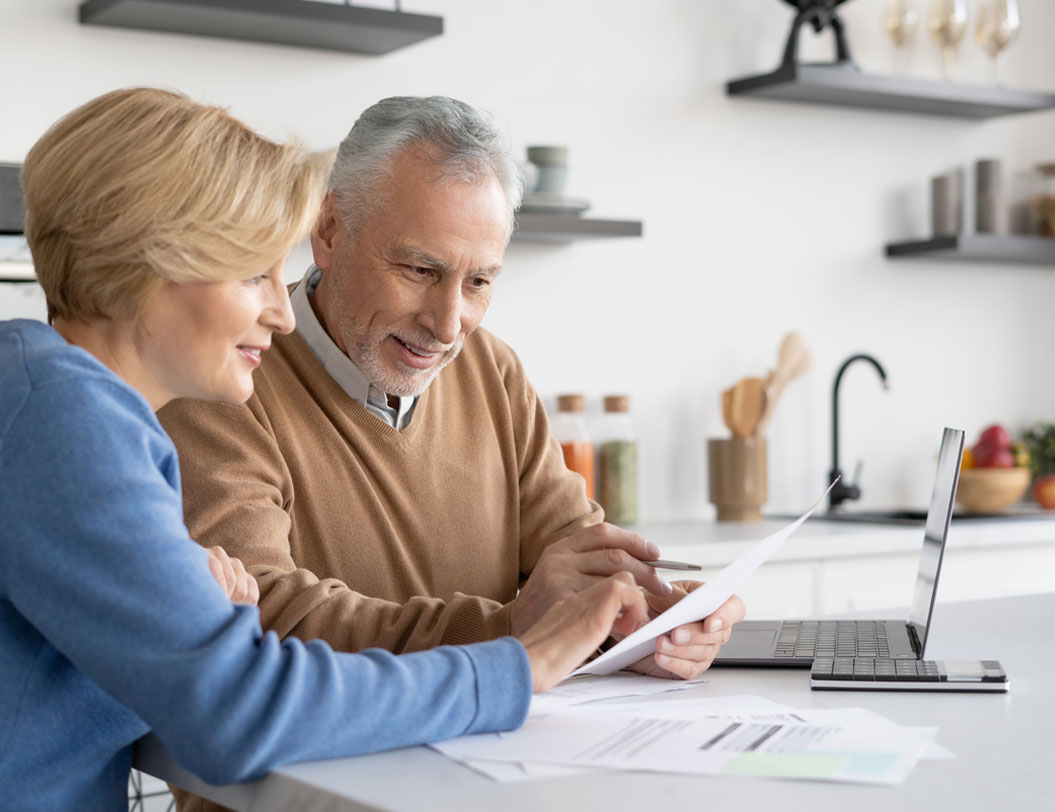 Mature couple reviewing expenses