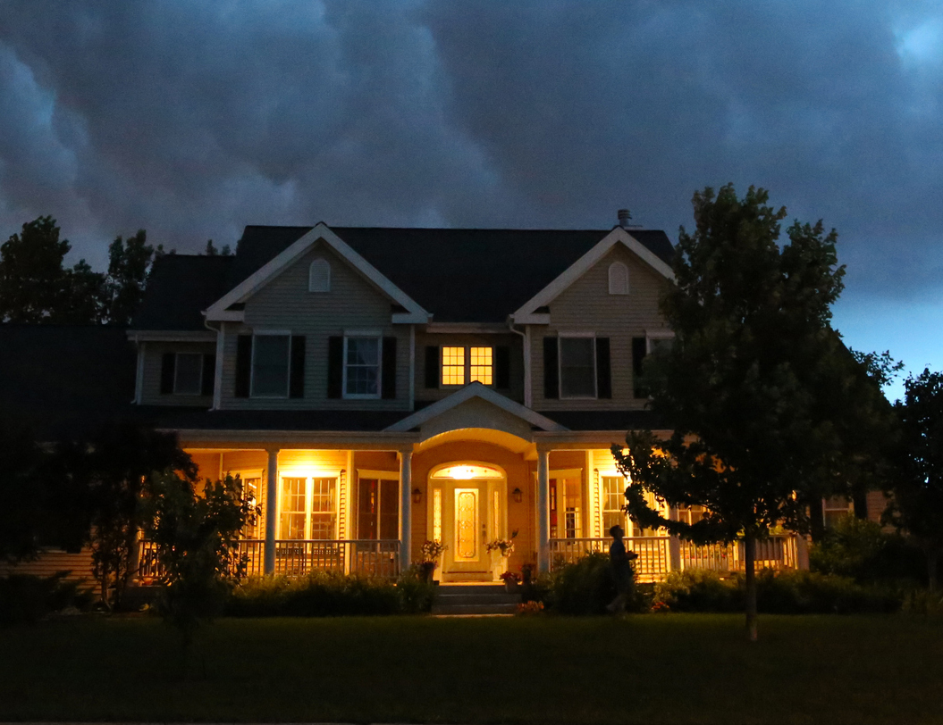 Exterior image of home with storm clouds above