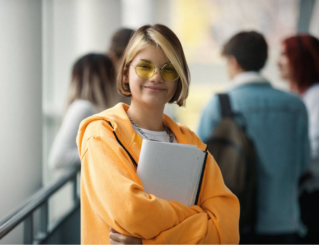 Female college student holding books