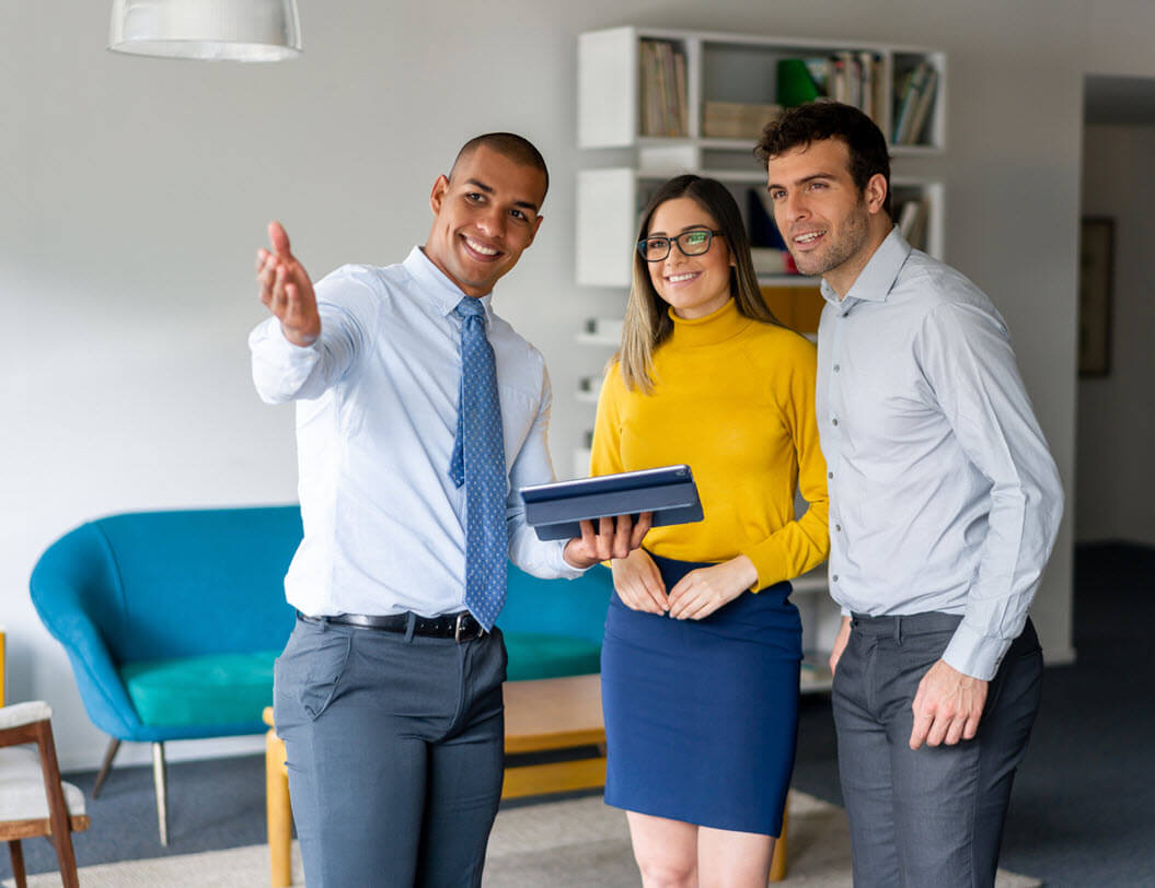 Realtor showing a couple a home