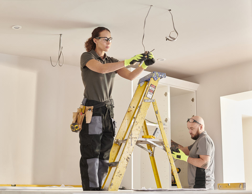 Man and woman remodeling a kitchen