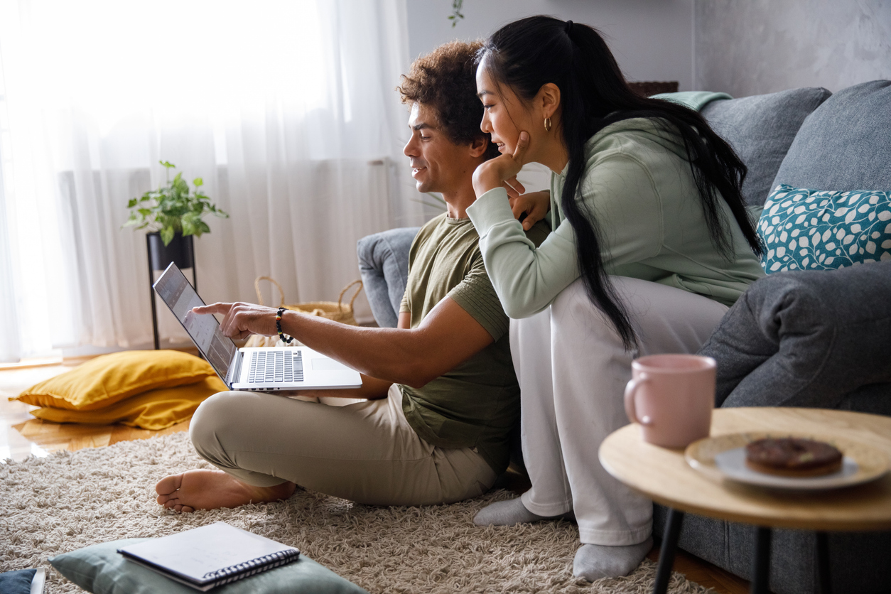 Millennial couple looking at their finances via online banking stock photo