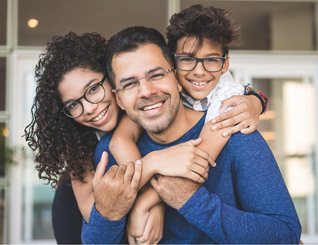 Father with two kids on his back