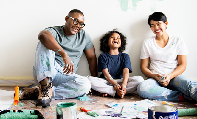 family painting a room