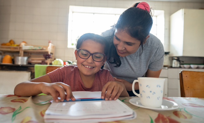 Mother helping her son with homework