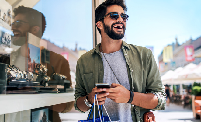 Young man shopping for watches
