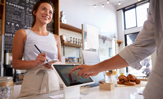 Person placing a food order on a tablet